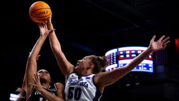 Kansas State Wildcats center Ayoka Lee (50) blocks Cincinnati Bearcats forward Brianna Byars (10) in