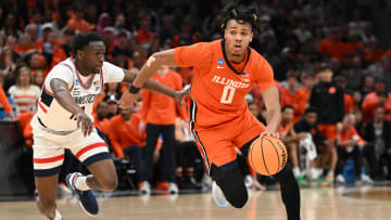 Mar 30, 2024; Boston, MA, USA; Illinois Fighting Illini guard Terrence Shannon Jr. (0) dribbles the ball against Connecticut Huskies guard Hassan Diarra (10) in the finals of the East Regional of the 2024 NCAA Tournament at TD Garden. Mandatory Credit: Brian Fluharty-USA TODAY Sports