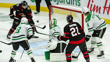 Jan 12, 2025; Ottawa, Ontario, CAN; Ottawa Senators center Matthew Highmore (15) swings at the puck in front of Dallas Stars goalie Casey DeSmith (1) in the third period at the Canadian Tire Centre. Mandatory Credit: Marc DesRosiers-Imagn Images