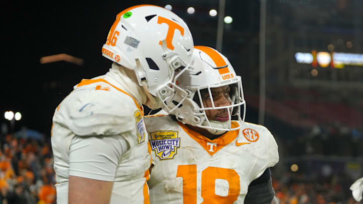 Tennessee running back DeSean Bishop (18) celebrates with Tennessee quarterback Joey Aguilar (6) after scoring a touchdown during the 2025 Music City Bowl at Nissan Stadium in Nashville, Tenn., on Dec. 30, 2025.