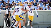 Oct 5, 2024; Chapel Hill, North Carolina, USA;  Pittsburgh Panthers wide reciever Censere Lee (11) celebrates with tight end Gavin Bartholomew (86) after scoring a touchdown in the second quarter at Kenan Memorial Stadium. Mandatory Credit: Bob Donnan-Imagn Images
