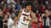 Nov 11, 2025; Louisville, Kentucky, USA;  Louisville Cardinals guard Mikel Brown Jr. (0) reacts after making a three pointer against the Kentucky Wildcats during the first half at KFC Yum! Center. Mandatory Credit: Jamie Rhodes-Imagn Images