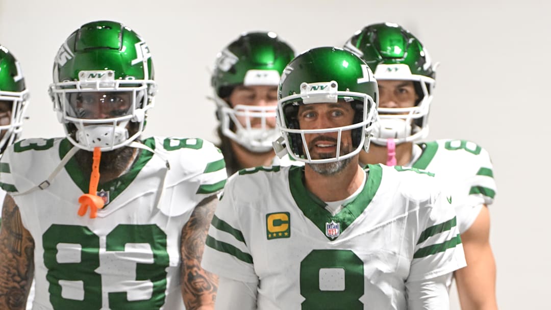 Oct 20, 2024; Pittsburgh, Pennsylvania, USA; New York Jets quarterback Aaron Rodgers (8) walks onto the field for a game against the Pittsburgh Steelers at Acrisure Stadium. Mandatory Credit: Barry Reeger-Imagn Images