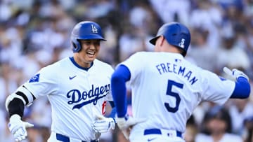 Jul 21, 2024; Los Angeles, California, USA; Los Angeles Dodgers designated hitter Shohei Ohtani (17) celebrates with Los Angeles Dodgers first baseman Freddie Freeman (5) after hitting a home run against the Boston Red Sox during the fifth inning at Dodger Stadium. Mandatory Credit: Jonathan Hui-USA TODAY Sports