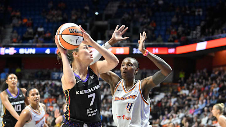Jun 18, 2025; Uncasville, Connecticut, USA; Connecticut Sun forward Haley Peters (7) shoots over Phoenix Mercury forward Natasha Mack (4) during the first half at Mohegan Sun Arena. Mandatory Credit: Eric Canha-Imagn Images