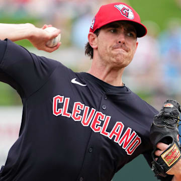 Mar 12, 2024; Surprise, Arizona, USA; Cleveland Guardians starting pitcher Shane Bieber (57) bats against the Texas Rangers during the second inning at Surprise Stadium.