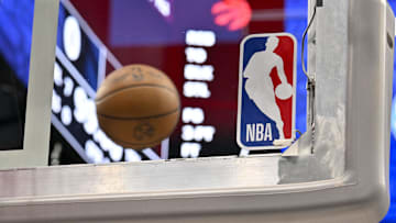 Apr 11, 2025; Dallas, Texas, USA; A view of an NBA basketball and backyard and NBA logo before the game between the Dallas Mavericks and the Toronto Raptors at the American Airlines Center. Mandatory Credit: Jerome Miron-Imagn Images