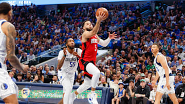 Apr 7, 2024; Dallas, Texas, USA; Houston Rockets guard Fred VanVleet (5) heads to the basket with Dallas Mavericks forward Derrick Jones Jr. (55) trailing during the third quarter at American Airlines Center. Mandatory Credit: Andrew Dieb-Imagn Images