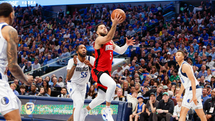 Apr 7, 2024; Dallas, Texas, USA; Houston Rockets guard Fred VanVleet (5) heads to the basket with Dallas Mavericks forward Derrick Jones Jr. (55) trailing during the third quarter at American Airlines Center. Mandatory Credit: Andrew Dieb-Imagn Images