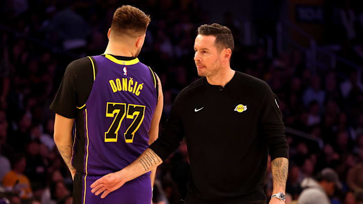 Los Angeles Lakers head coach JJ Redick talks to guard Luka Doncic (77) during the second quarter against the LA Clippers at Crypto.com Arena. Los Angeles Lakers head coach JJ Redick talks to guard Luka Doncic (77) during the second quarter against the LA Clippers at Crypto.com Arena.