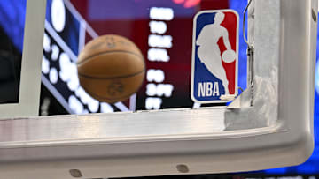 A view of an NBA basketball and backyard and NBA logo before the game between the Dallas Mavericks and the Toronto Raptors.