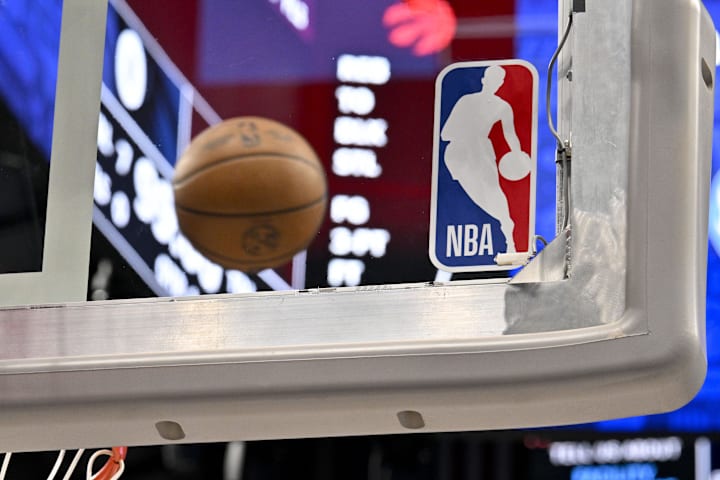 A view of an NBA basketball and backyard and NBA logo before the game between the Dallas Mavericks and the Toronto Raptors.