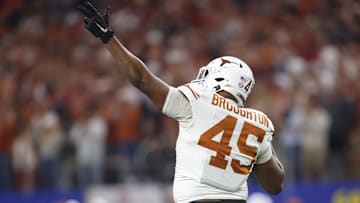 Jan 10, 2025; Arlington, Texas, USA; Texas Longhorns defensive lineman Vernon Broughton (45) celebrates after a sack during the third quarter of the College Football Playoff semifinal against the Ohio State Buckeyes in the Cotton Bowl at AT&T Stadium.