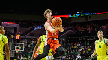 Jan 2, 2025; Eugene, Oregon, USA; Illinois Fighting Illini guard Kasparas Jakucionis (32) drives to the basket during the second half against the Oregon Ducks at Matthew Knight Arena. Mandatory Credit: Craig Strobeck-Imagn Images
