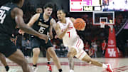 Nov 8, 2025; Houston, Texas, USA; Houston Cougars guard Milos Uzan (7) drives witht the ball as Towson Tigers guard Tyler Tejada (15) defends during the second half at Fertitta Center. Mandatory Credit: Troy Taormina-Imagn Images