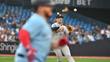 Jun 6, 2023: Houston Astros third baseman Alex Bregman throws to first base to get the out against Toronto Blue Jays catcher Alejandro Kirk (30) in the second  inning at Rogers Centre. 