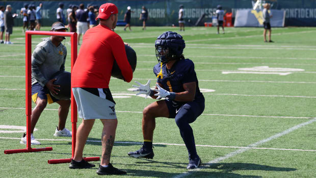 West Virginia University running back Jahiem White running drills during fall camp (2024).