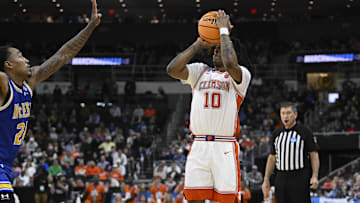 Mar 20, 2025; Providence, RI, USA; Clemson Tigers guard Del Jones (10) shoots the ball against McNeese State Cowboys forward Christian Shumate (24) during the first half at Amica Mutual Pavilion. Mandatory Credit: Eric Canha-Imagn Images
