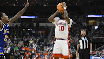 Mar 20, 2025; Providence, RI, USA; Clemson Tigers guard Del Jones (10) shoots the ball against McNeese State Cowboys forward Christian Shumate (24) during the first half at Amica Mutual Pavilion. Mandatory Credit: Eric Canha-Imagn Images