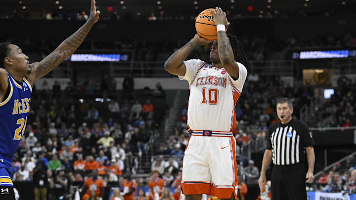 Mar 20, 2025; Providence, RI, USA; Clemson Tigers guard Del Jones (10) shoots the ball against McNeese State Cowboys forward Christian Shumate (24) during the first half at Amica Mutual Pavilion. Mandatory Credit: Eric Canha-Imagn Images