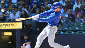 Jun 30, 2024; Milwaukee, Wisconsin, USA; Chicago Cubs designated hitter Cody Bellinger (24) hits a single against the Milwaukee Brewers in the first inning at American Family Field. Mandatory Credit: Benny Sieu-USA TODAY Sports