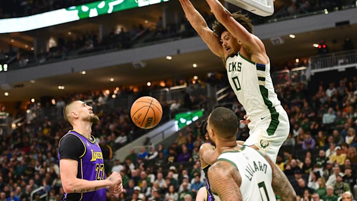 Milwaukee’s Jericho Sims dunks near Los Angeles Lakers center Alex Len during the second quarter. Milwaukee’s Jericho Sims dunks near Los Angeles Lakers center Alex Len during the second quarter.