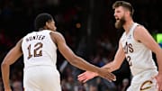 Nov 2, 2025; Cleveland, Ohio, USA; Cleveland Cavaliers forward De'Andre Hunter (12) celebrates with forward Dean Wade (32) during the second half against the Atlanta Hawks at Rocket Arena. Mandatory Credit: Ken Blaze-Imagn Images
