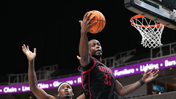 Dec 21, 2024; San Jose, California, USA; San Diego State Aztecs forward Jared Coleman-Jones (31) rebounds against California Golden Bears forward Lee Dort (left) during the second half at SAP Center. Mandatory Credit: Darren Yamashita-Imagn Images