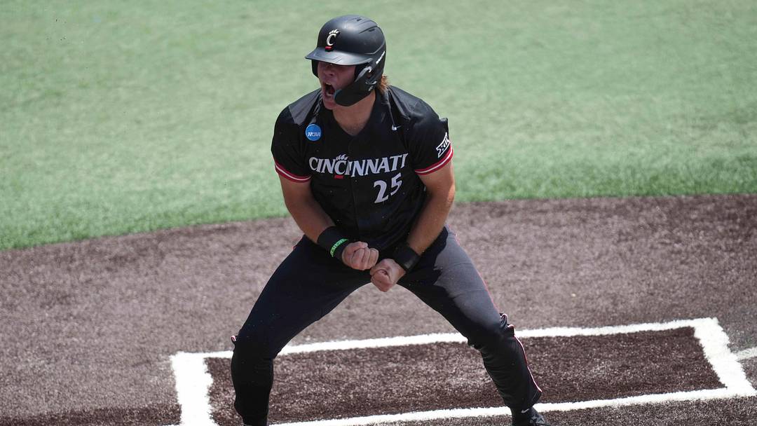 Cincinnati infielder Quinton Coats (25) celebrates after scoring a run during a NCAA regional baseball game between Cincinnati and Wake Forest at Lindsey Nelson Stadium in Knoxville, Tenn., on May 30, 2025.
