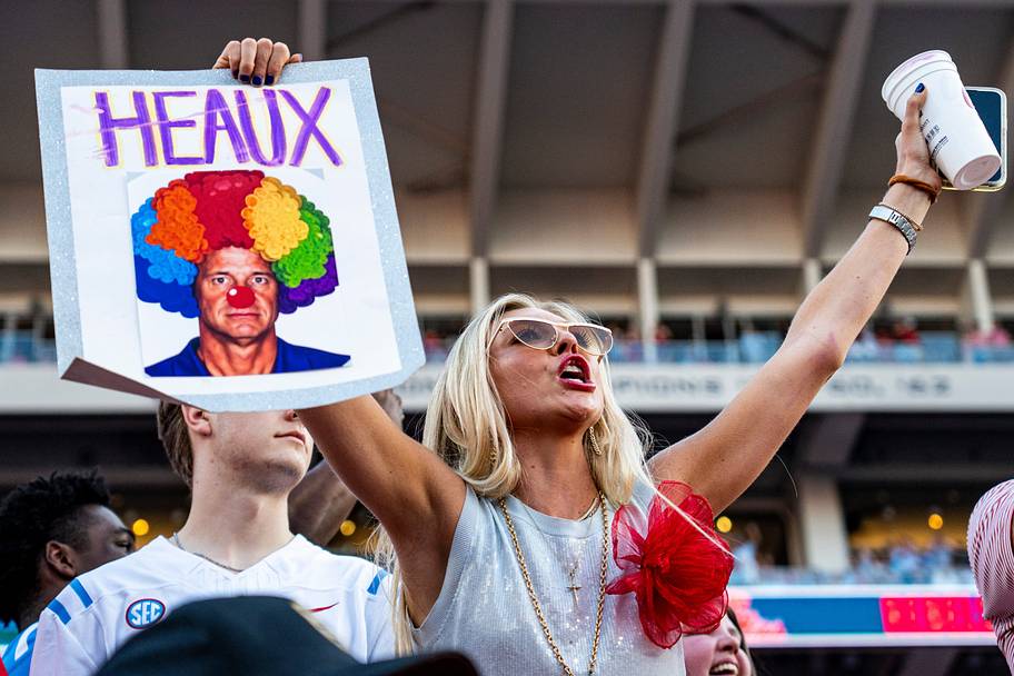 A fan holds up a Lane Kiffin sign before Saturday’s game.