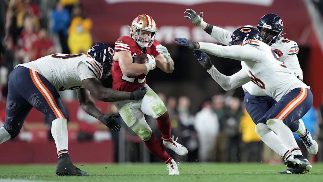 Dec 28, 2025; Santa Clara, California, USA; Chicago Bears defensive tackle Gervon Dexter Sr. (99) tackles San Francisco 49ers running back Christian McCaffrey (23) in the second half at Levi's Stadium. Mandatory Credit: Kyle Terada-Imagn Images
