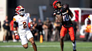 Cincinnati Bearcats wide receiver Caleb Goodie (10) catches a pass and runs for a touchdown as Iowa State Cyclones defensive back Jamison Patton (2) defends in the fourth quarter of the NCAA football game between the Cincinnati Bearcats and Iowa State Cyclones at Nippert Stadium in Cincinnati on Oct. 4, 2025.
