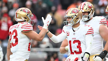 San Francisco 49ers running back Christian McCaffrey and quarterback Brock Purdy celebrate a touchdown