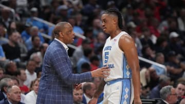 Mar 28, 2024; Los Angeles, CA, USA; North Carolina Tar Heels head coach Hubert Davis talks with forward Armando Bacot (5) in the first half against the Alabama Crimson Tide in the semifinals of the West Regional of the 2024 NCAA Tournament at Crypto.com Arena. Mandatory Credit: Kirby Lee-USA TODAY Sports