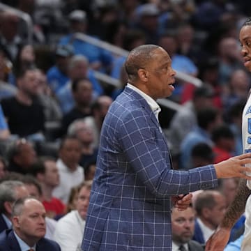 UNC basketball head coach Hubert Davis and big man Armando Bacot