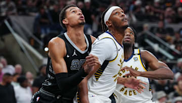 Mar 3, 2024; San Antonio, Texas, USA; San Antonio Spurs center Victor Wembanyama (1) and Indiana Pacers center Myles Turner (33) battle for position in the second half at Frost Bank Center. Mandatory Credit: Daniel Dunn-Imagn Images