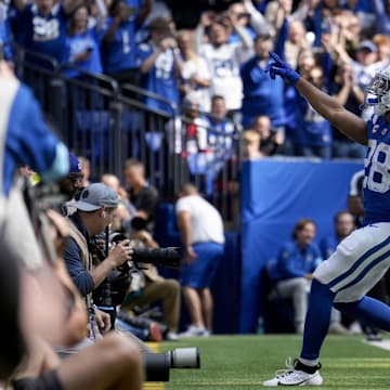 Sep 8, 2024; Indianapolis, Indiana, USA; Indianapolis Colts running back Jonathan Taylor (28) celebrates as he runs in for a touchdown Sunday, Sept. 8, 2024, during a game against the Houston Texans at Lucas Oil Stadium. Mandatory Credit: Grace Hollars/USA TODAY Network via Imagn Images