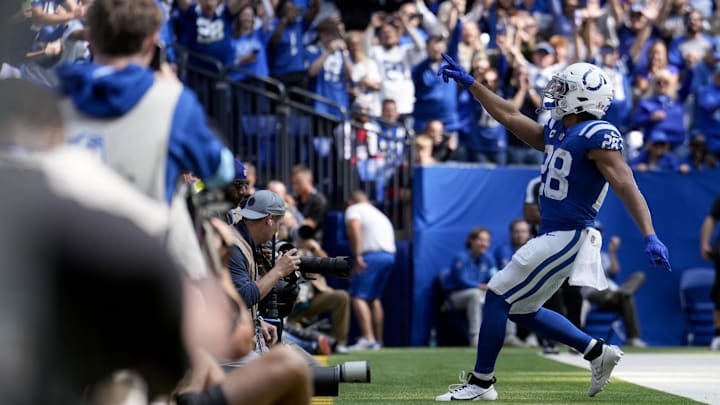 Sep 8, 2024; Indianapolis, Indiana, USA; Indianapolis Colts running back Jonathan Taylor (28) celebrates as he runs in for a touchdown Sunday, Sept. 8, 2024, during a game against the Houston Texans at Lucas Oil Stadium. Mandatory Credit: Grace Hollars/USA TODAY Network via Imagn Images