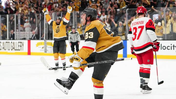 Jun 6, 2026; Las Vegas, Nevada, USA; Vegas Golden Knights right wing Mitch Marner (93) celebrates after a goal by defenseman Shea Theodore (not pictured) as Carolina Hurricanes right wing Andrei Svechnikov (37) reacts during the second overtime in game three of the 2026 Stanley Cup Final at T-Mobile Arena. Mandatory Credit: Stephen R. Sylvanie-Imagn Images