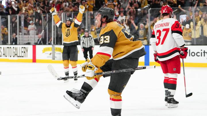 Jun 6, 2026; Las Vegas, Nevada, USA; Vegas Golden Knights right wing Mitch Marner (93) celebrates after a goal by defenseman Shea Theodore (not pictured) as Carolina Hurricanes right wing Andrei Svechnikov (37) reacts during the second overtime in game three of the 2026 Stanley Cup Final at T-Mobile Arena. Mandatory Credit: Stephen R. Sylvanie-Imagn Images