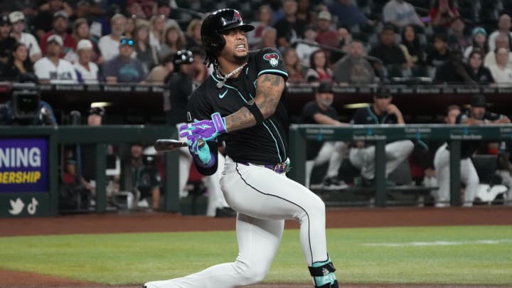 Aug 12, 2024; Phoenix, Arizona, USA; Arizona Diamondbacks second base Ketel Marte (4) reacts after twisting his foot against the Colorado Rockies in the first inning at Chase Field. Mandatory Credit: Rick Scuteri-USA TODAY Sports