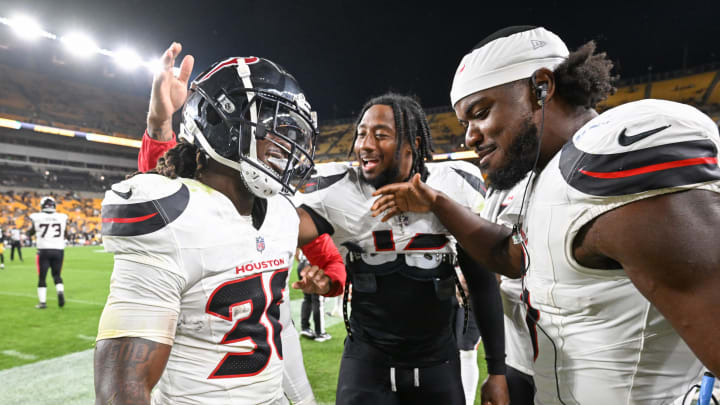 Aug 9, 2024; Pittsburgh, Pennsylvania, USA;  Houston Texans safety Brandon Hill (36) celebrates with Del'Shawn Phillips (13) and Azeez Al-Shaair (0) after intercepting Pittsburgh Steelers quarterback Kyle Allen during the fourth quarter at Acrisure Stadium. Mandatory Credit: Barry Reeger-USA TODAY Sports