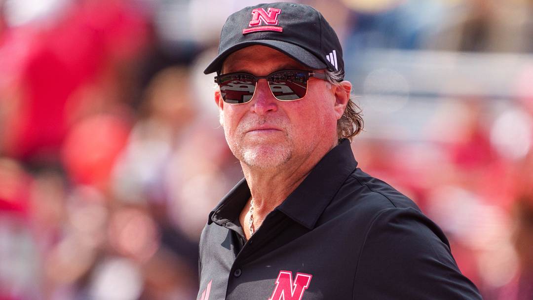 Dana Holgorsen watches pre-game warm-ups last season.