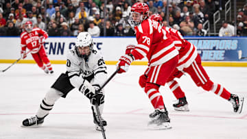 Apr 12, 2025; St. Louis, Missouri, UNITED STATES; Boston University Terriers defenseman Sascha Boumedienne (78) defends against Western Michigan Broncos forward Alex Bump (20) during the second period of the Frozen Four college ice hockey national championship at Enterprise Center. Mandatory Credit: Connor Hamilton-Imagn Images