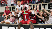 Louisville Cardinals' Isaac Brown celebrates in the endzone with fans after his 78-yard touchdown run against James Madison University as the Cards win 28-14 Friday September 5, 2025 at L&N Credit Union Stadium in Louisville, Kentucky.