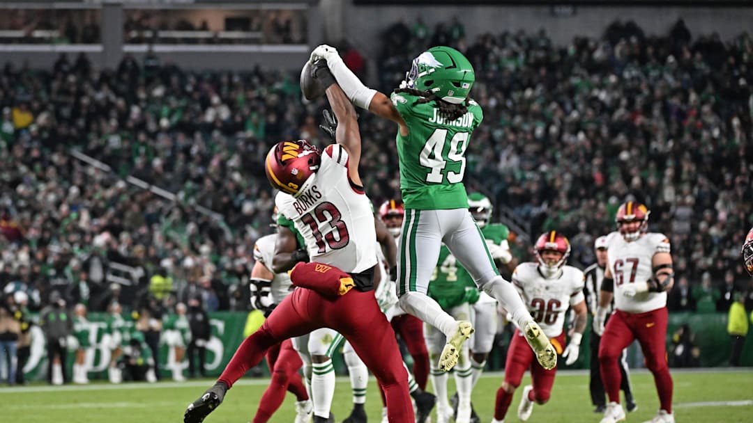 Jan 4, 2026; Philadelphia, Pennsylvania, USA; Philadelphia Eagles safety Brandon Johnson (49) breaks up pass intended for Washington Commanders wide receiver Treylon Burks (13) at Lincoln Financial Field. 