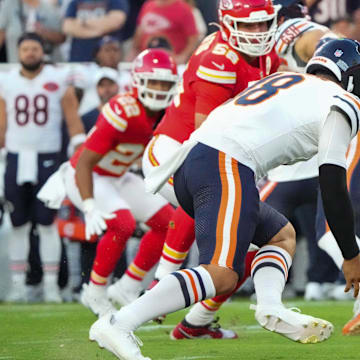 Caleb Williams tries to recover a botched handoff to Olamide Zaccheaus in Friday's game.