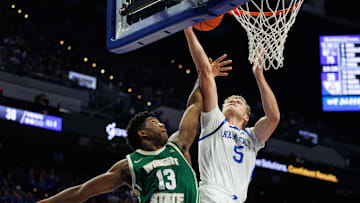 Nov 4, 2024; Lexington, Kentucky, USA; Kentucky Wildcats guard Collin Chandler (5) goes to the basket against Wright State Raiders guard Solomon Callaghan (13) during the second half at Rupp Arena at Central Bank Center. Mandatory Credit: Jordan Prather-Imagn Images