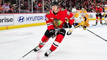 Feb 7, 2025; Chicago, Illinois, USA; Chicago Blackhawks center Connor Bedard (98) skates with the puck against the Nashville Predators during the third period at the United Center. Mandatory Credit: Daniel Bartel-Imagn Images
