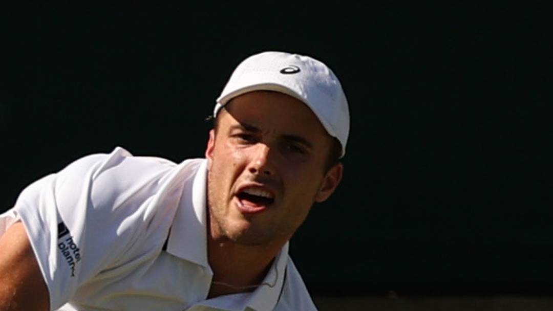 Arthur Fery serves the ball in his match at Wimbledon